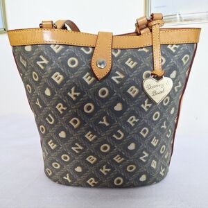 Vtg.Dooney & Bourke"A Bucket Full Of Class"Crossword pattern bucket purse.